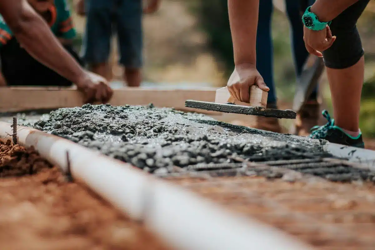 Image of concrete being spread.